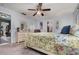 Inviting bedroom featuring light blue walls and glimpses of an adjacent kitchen and bathroom at 1176 Balfour Dr, Deltona, FL 32725