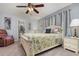 Cozy bedroom with a floral bedspread and light-colored walls offers a serene retreat at 1176 Balfour Dr, Deltona, FL 32725