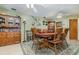 Spacious dining room with a large table, ceiling fans, and ample space for entertaining guests at 1176 Balfour Dr, Deltona, FL 32725