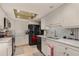 Well-lit kitchen with white cabinets, stainless steel appliances, and stylish backsplash at 1176 Balfour Dr, Deltona, FL 32725