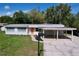 Aerial view of the home displaying the front yard, carport and location at 1625 Avenue D Ne, Winter Haven, FL 33881