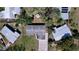 Drone shot of the home showing roof, driveway, yard and surrounding neighborhood at 1625 Avenue D Ne, Winter Haven, FL 33881