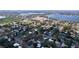 Picturesque aerial shot of a community near a lake, showcasing residential areas with a school and water tower at 1625 Avenue D Ne, Winter Haven, FL 33881