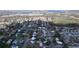 Overhead view of a neighborhood near a lake, displaying numerous residences and surrounding green spaces at 1625 Avenue D Ne, Winter Haven, FL 33881