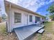 Charming back deck area with seating, offering a peaceful outdoor retreat at 1625 Avenue D Ne, Winter Haven, FL 33881