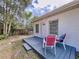 Cozy back deck area with seating, perfect for relaxing outdoors at 1625 Avenue D Ne, Winter Haven, FL 33881