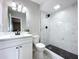 Updated bathroom with new marble shower, modern vanity, and black fixtures at 1625 Avenue D Ne, Winter Haven, FL 33881