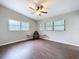 Open bedroom featuring wood floors, vaulted ceilings, and stylish accent tables at 1625 Avenue D Ne, Winter Haven, FL 33881