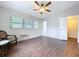 Spacious bedroom with sleek wood floors, bright windows, and a modern ceiling fan at 1625 Avenue D Ne, Winter Haven, FL 33881