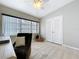 Bedroom with a large window, closet, a decorative rug and a ceiling fan at 1625 Avenue D Ne, Winter Haven, FL 33881