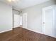 Neutral bedroom featuring gleaming wood floors, a ceiling fan, and multiple storage options at 1625 Avenue D Ne, Winter Haven, FL 33881