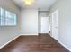 Neutral bedroom featuring gleaming wood floors, bright windows, and lots of storage at 1625 Avenue D Ne, Winter Haven, FL 33881