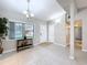 Inviting entryway featuring ceramic tile flooring, a charming console table, and a well-lit, welcoming ambiance at 1625 Avenue D Ne, Winter Haven, FL 33881