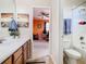 Bathroom sink with wooden cabinets and a view of the bedroom at 374 Villa Sorrento Cir, Haines City, FL 33844