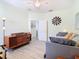 View of a guest bedroom with a daybed, ceiling fan, and wood flooring at 374 Villa Sorrento Cir, Haines City, FL 33844