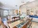 This elegant dining room showcases beautiful furnishings with natural light flowing into the living spaces at 374 Villa Sorrento Cir, Haines City, FL 33844