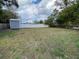 Spacious backyard with storage shed and privacy fence, perfect for outdoor activities at 753 Avenue O Se, Winter Haven, FL 33880