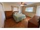 Bedroom with ceiling fan, wood parquet flooring, and a large window at 753 Avenue O Se, Winter Haven, FL 33880