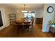 A dining room area with wooden table and chairs next to a living area at 753 Avenue O Se, Winter Haven, FL 33880