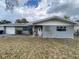 Charming single-story home with gray exterior, well-kept lawn, and inviting front porch at 753 Avenue O Se, Winter Haven, FL 33880