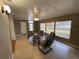 Living room with neutral tones, a ceiling fan, and four chairs around a table at 753 Avenue O Se, Winter Haven, FL 33880