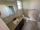 Bathroom featuring a vanity, toilet, and a shower/tub combo at 100 High St, Winter Haven, FL 33880