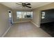 Bright dining area features tile flooring and a large window overlooking the front yard at 100 High St, Winter Haven, FL 33880