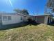 Single-story home with a carport and a small front lawn at 100 High St, Winter Haven, FL 33880