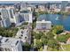 Stunning aerial view of city buildings and lake showcasing the urban landscape at 101 S Eola Dr # 813, Orlando, FL 32801