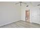 Bedroom featuring hardwood floors, ensuite bathroom, and neutral walls at 101 S Eola Dr # 813, Orlando, FL 32801