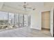 Bright main bedroom featuring hardwood floors and a large window with city views at 101 S Eola Dr # 813, Orlando, FL 32801