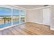 Bedroom featuring floor-to-ceiling sliding glass doors offering unobstructed ocean views and access to the balcony at 15 Marden Dr, Ormond Beach, FL 32176