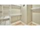 Walk-in closet featuring wood floors, multiple shelves, and metal clothing rods at 15 Marden Dr, Ormond Beach, FL 32176