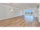 Bright living room with ocean view and sliding glass door access to oceanfront balcony and staircase at 15 Marden Dr, Ormond Beach, FL 32176