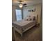 Comfortable bedroom with neutral walls, carpet, ceiling fan and natural light at 1310 Seasons Blvd, Kissimmee, FL 34746