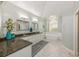 Elegant bathroom with a dual sink vanity and soaking tub at 1503 N Greenleaf Ct, Winter Springs, FL 32708