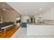 Bright kitchen with a center island, white cabinets, stainless steel appliances, and hardwood flooring at 1503 N Greenleaf Ct, Winter Springs, FL 32708