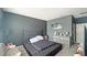 Serene main bedroom featuring a large tufted bed and neutral decor at 9362 Oglethorpe Dr, Groveland, FL 34736