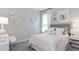 Charming bedroom with pastel decor, soft lighting, and cozy furnishings at 5680 Vinyasa Rd, Clermont, FL 34714