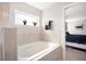 Bathroom featuring a stand alone tub and views into the connected bedroom at 653 Vittorio Dr, Winter Haven, FL 33884