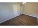 Bright bedroom featuring wood-look floors, neutral walls, ceiling fan and a closet at 1804 S Mellonville Ave, Sanford, FL 32771