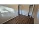 Cozy bedroom with laminate flooring and a closet offers comfortable living space at 1804 S Mellonville Ave, Sanford, FL 32771