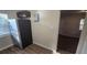 Bright kitchen with stainless steel refrigerator, laminate countertop, and wood-look flooring at 1804 S Mellonville Ave, Sanford, FL 32771