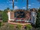 Elegant brick and black sign for Emerald Ridge featuring beautiful landscaping and flowering plants at 2024 Count Ct, Lakeland, FL 33813