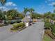 View of the guard house at the entry gate to Emerald Ridge featuring manicured landscaping at 2024 Count Ct, Lakeland, FL 33813