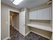 Office area features built-in desk and cabinets for storage with access to hallways at 2024 Count Ct, Lakeland, FL 33813