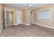 Empty bedroom boasting neutral walls, a ceiling fan, two closets and carpet flooring at 819 22Nd Nw St, Winter Haven, FL 33881
