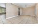 Dining room features tile floors, neutral walls, modern light fixture, and seating for four at 819 22Nd Nw St, Winter Haven, FL 33881