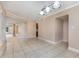 Open dining room with tile flooring and modern lighting at 819 22Nd Nw St, Winter Haven, FL 33881