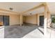 Spacious garage with concrete floor, exposed rafters, and two entry doors at 819 22Nd Nw St, Winter Haven, FL 33881